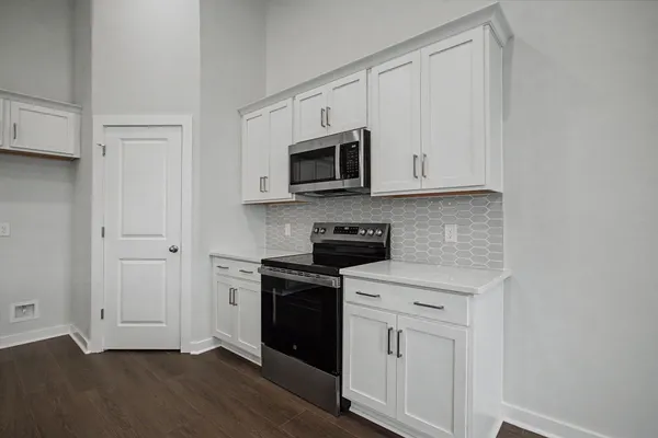 a view of cabinets and wooden floor