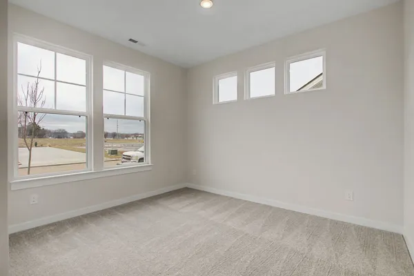 a view of an empty room and entryway