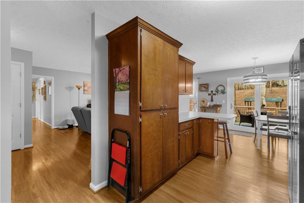 6124 Clyde Conner Road Murrayville, GA 30564 - Photo 14 of 48 a view of living room filled with furniture and wooden floor