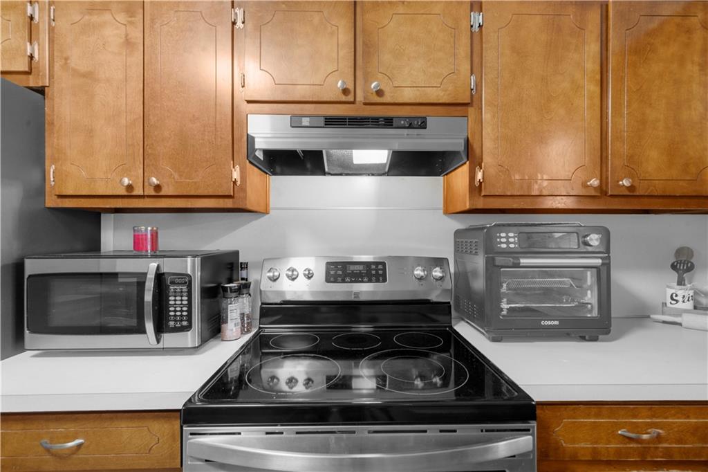 6124 Clyde Conner Road Murrayville, GA 30564 - Photo 16 of 48 a white stove top oven sitting inside of a kitchen