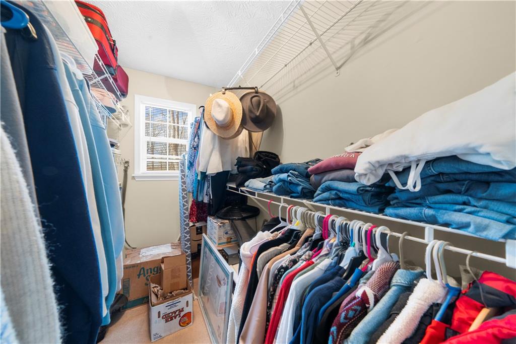 6124 Clyde Conner Road Murrayville, GA 30564 - Photo 17 of 48 a view of walk in closet with clothes and shoes
