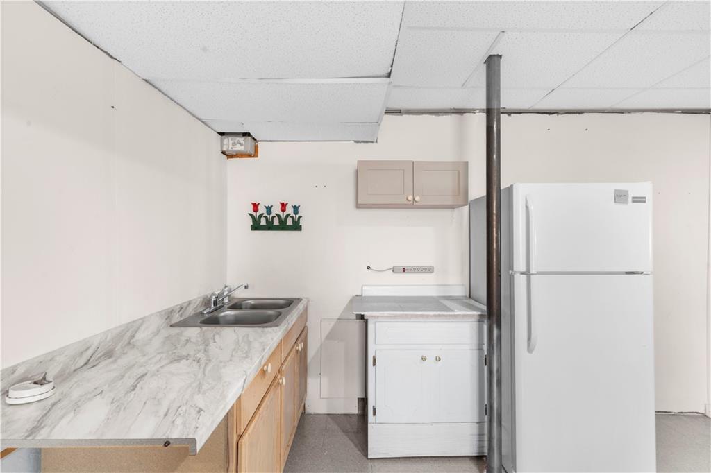 6124 Clyde Conner Road Murrayville, GA 30564 - Photo 28 of 48 a kitchen with a sink a stove and refrigerator