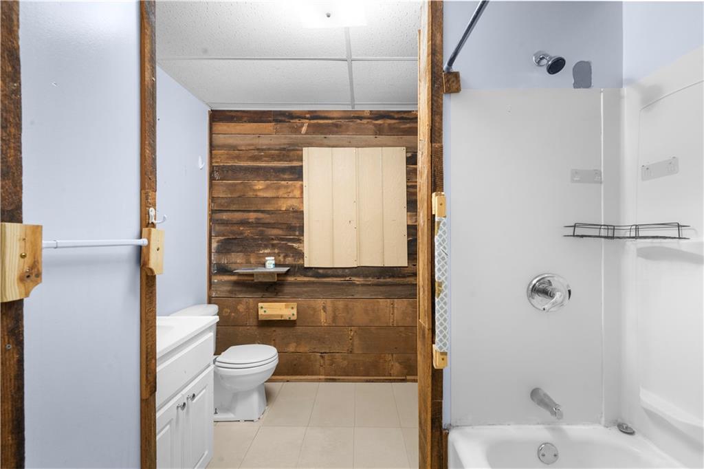 6124 Clyde Conner Road Murrayville, GA 30564 - Photo 30 of 48 a bathroom with a toilet and shower