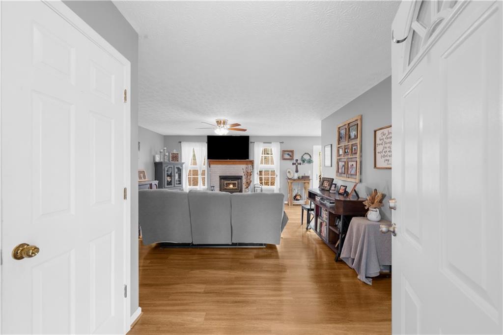6124 Clyde Conner Road Murrayville, GA 30564 - Photo 3 of 48 a living room with fireplace furniture and a flat screen tv