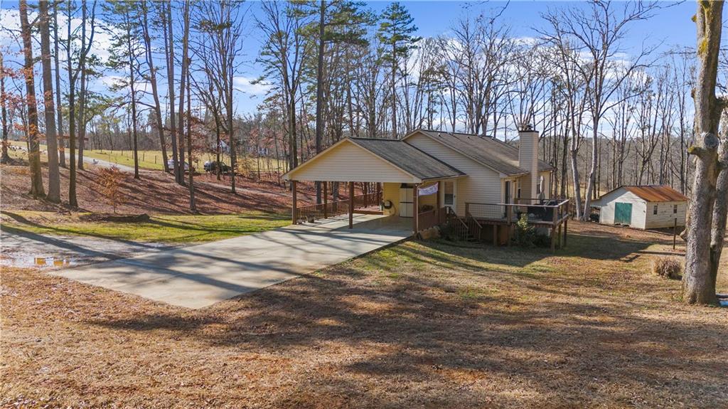 6124 Clyde Conner Road Murrayville, GA 30564 - Photo 42 of 48 a view of a house with swimming pool and sitting area