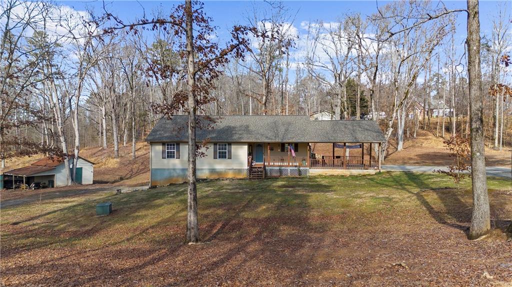 6124 Clyde Conner Road Murrayville, GA 30564 - Photo 44 of 48 a backyard of a house with table and chairs