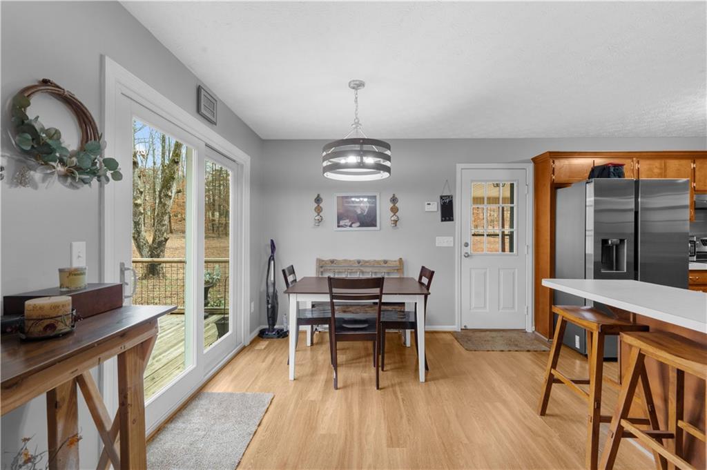 6124 Clyde Conner Road Murrayville, GA 30564 - Photo 8 of 48 a view of a dining room with furniture window and wooden floor