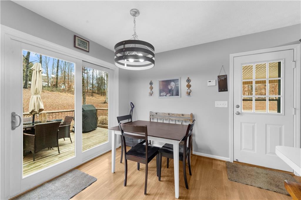 6124 Clyde Conner Road Murrayville, GA 30564 - Photo 9 of 48 a view of a dining room with furniture window and wooden floor
