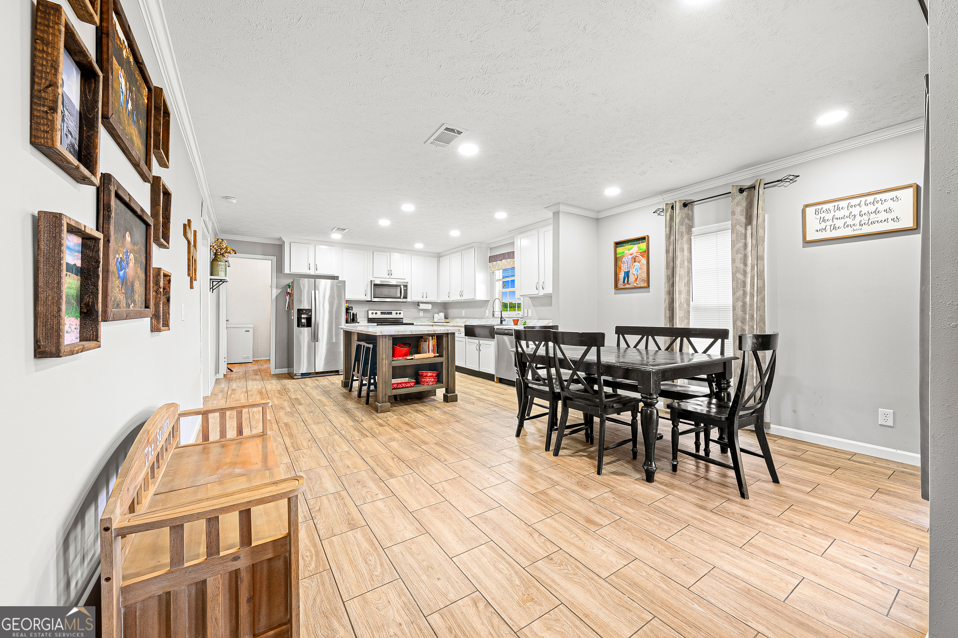 655 Lowe Road Comer, GA 30629 - Photo 6 of 19 a view of a dining hall with furniture and wooden floor