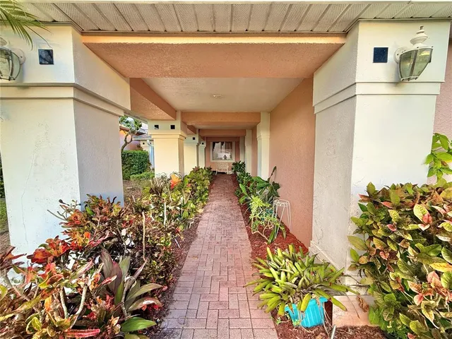 a bunch of flowers in front of a door