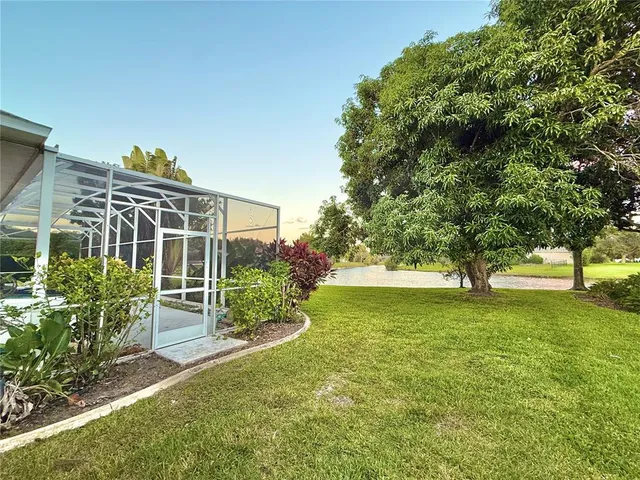 a view of a lake with houses in the back