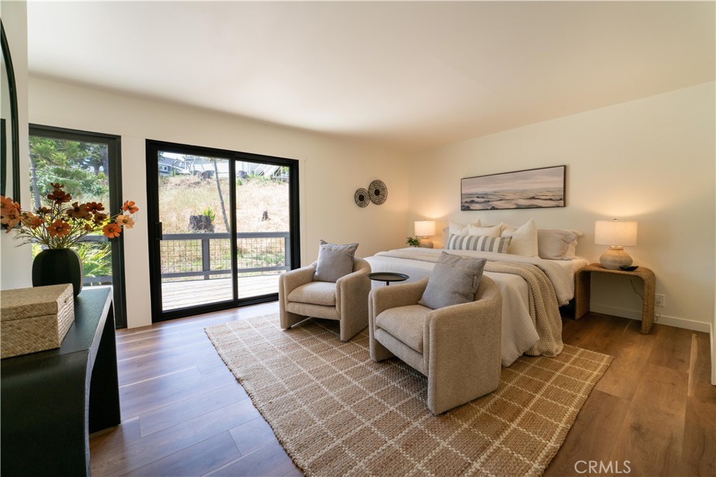 675 Huntington Road Cambria, CA 93428 - Photo 12 of 30 a bedroom with furniture and a large window