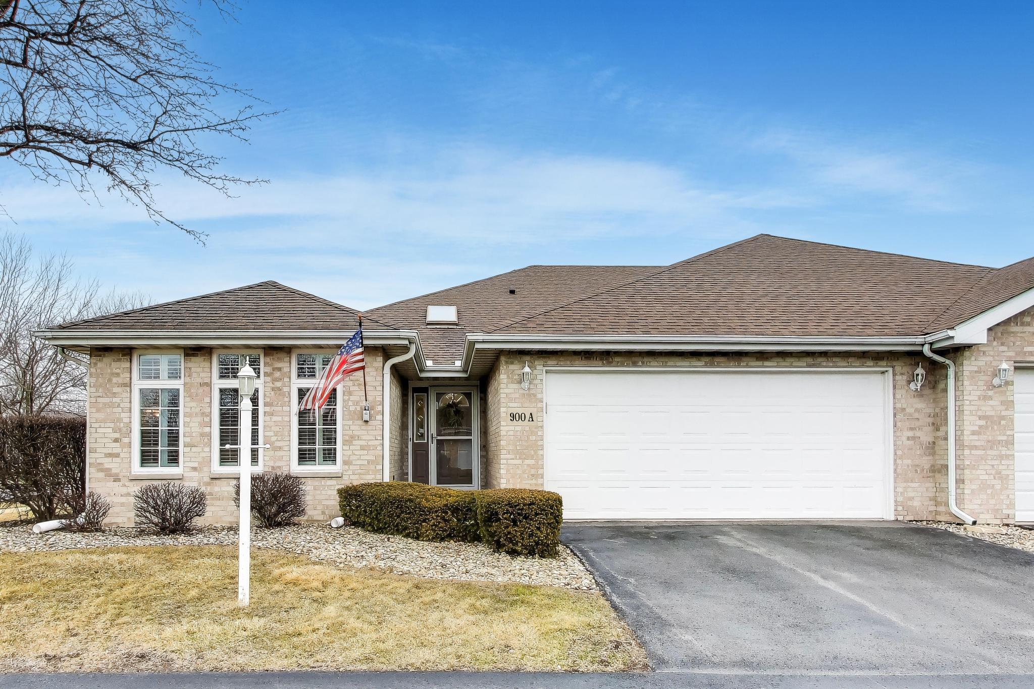900 A Easy Street Crown Point, IN 46307 - Photo 1 of 22 a front view of a house with garden