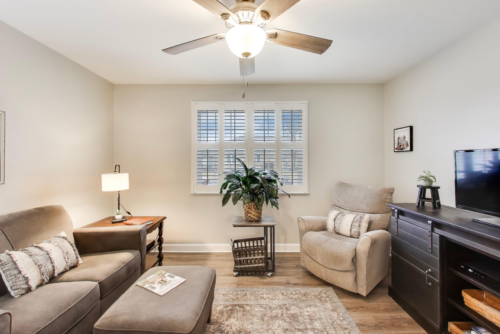 900 A Easy Street Crown Point, IN 46307 - Photo 14 of 22 a living room with furniture and a flat screen tv