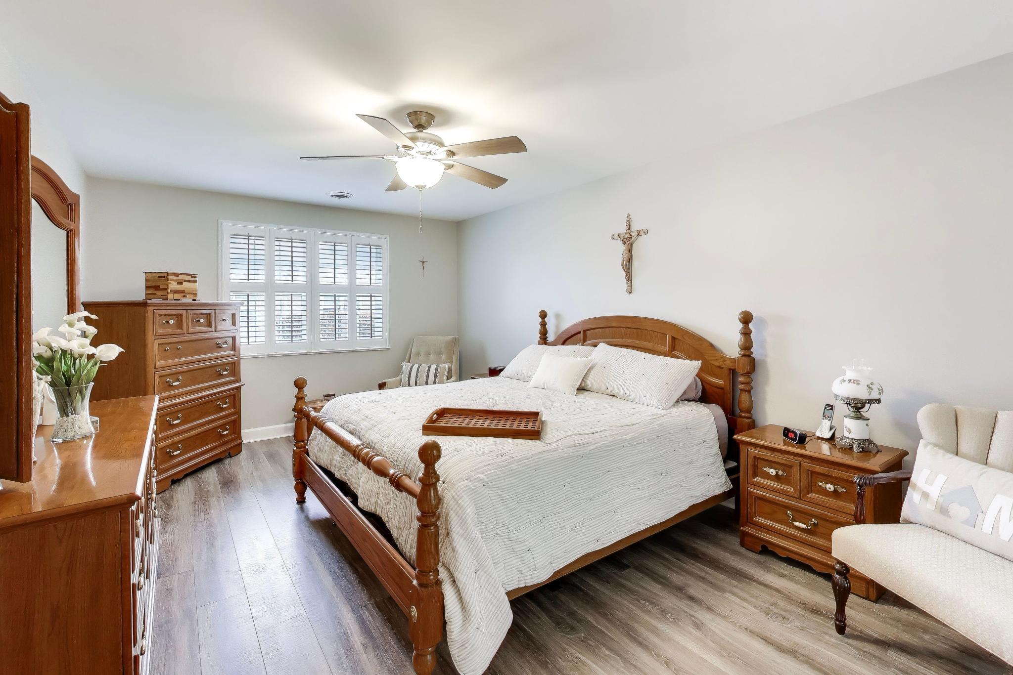 900 A Easy Street Crown Point, IN 46307 - Photo 15 of 22 a bedroom with a bed and wooden floor