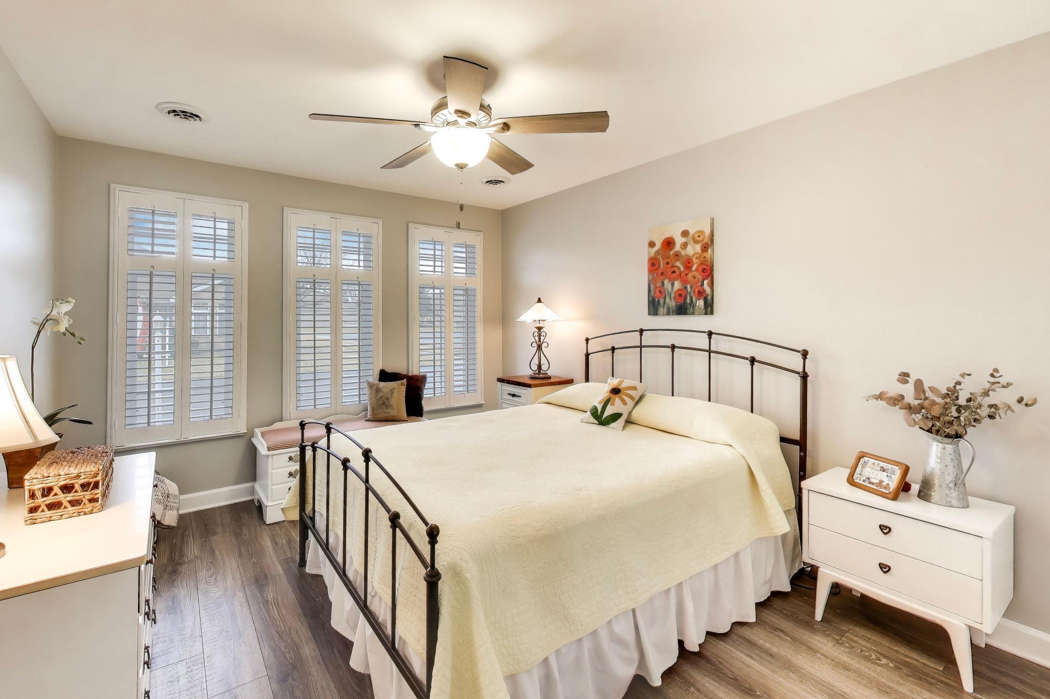 900 A Easy Street Crown Point, IN 46307 - Photo 19 of 22 a bedroom with a bed and a chandelier