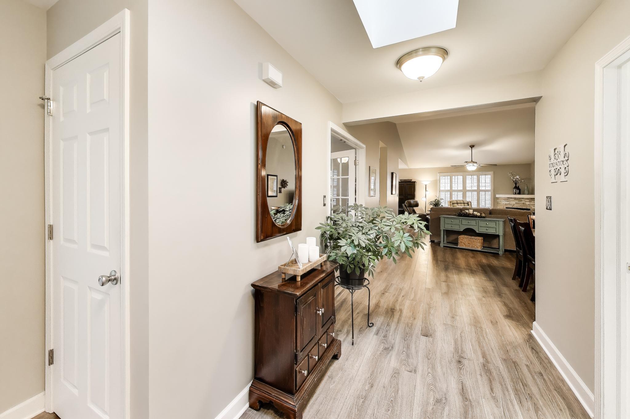 900 A Easy Street Crown Point, IN 46307 - Photo 2 of 22 a living room with furniture and a wooden floor