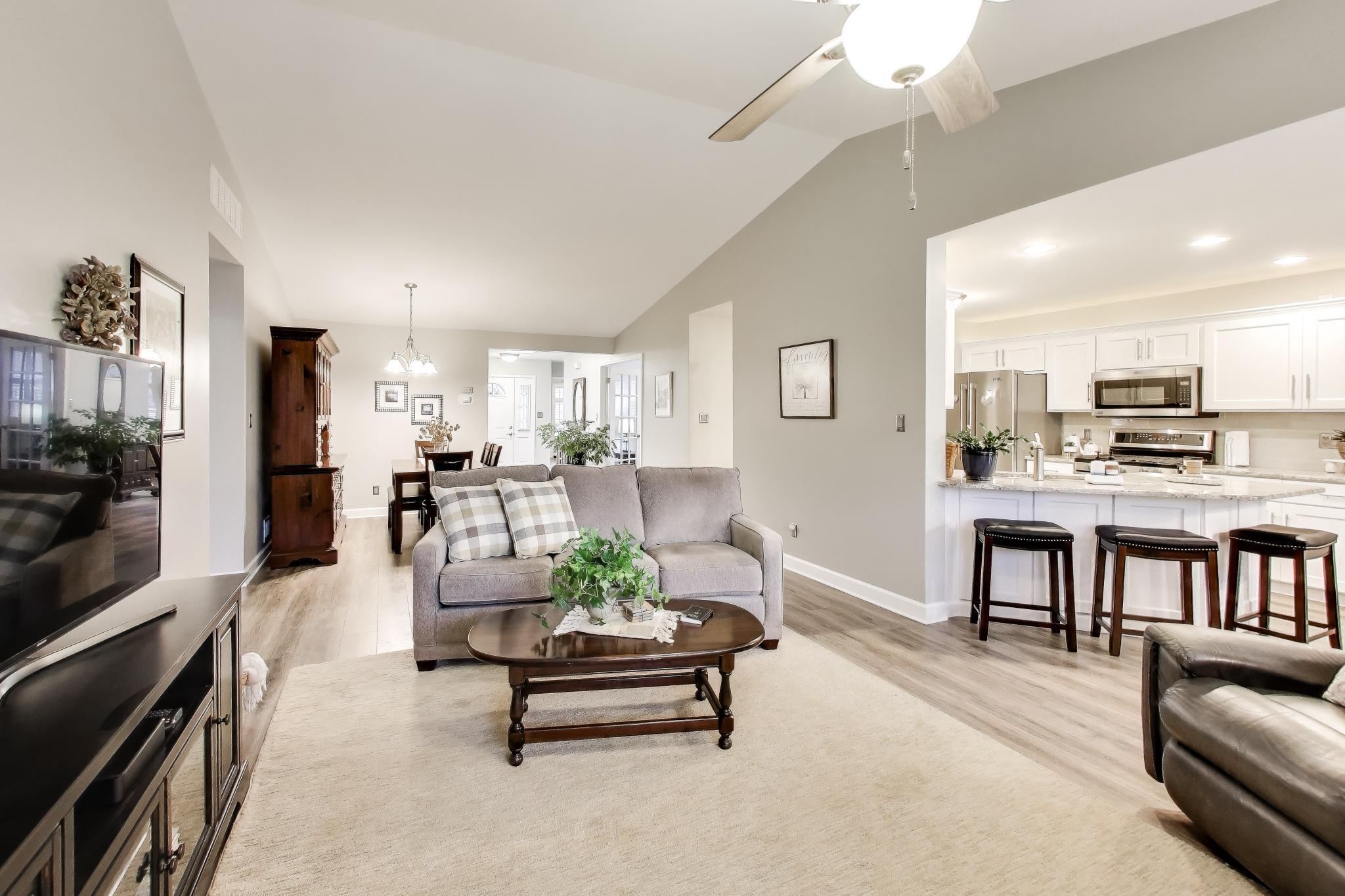 900 A Easy Street Crown Point, IN 46307 - Photo 4 of 22 a living room with furniture and a flat screen tv