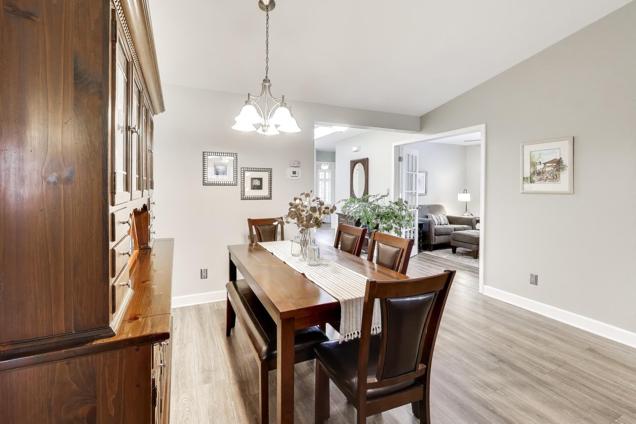 900 A Easy Street Crown Point, IN 46307 - Photo 7 of 22 a view of a dining room with furniture window and wooden floor