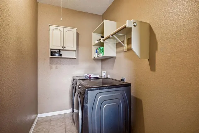 a view of walk in closet with clothes