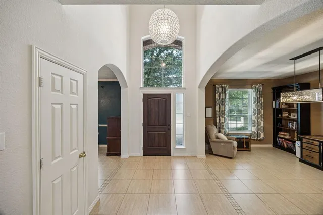 a view of a livingroom with furniture window and a flat screen tv