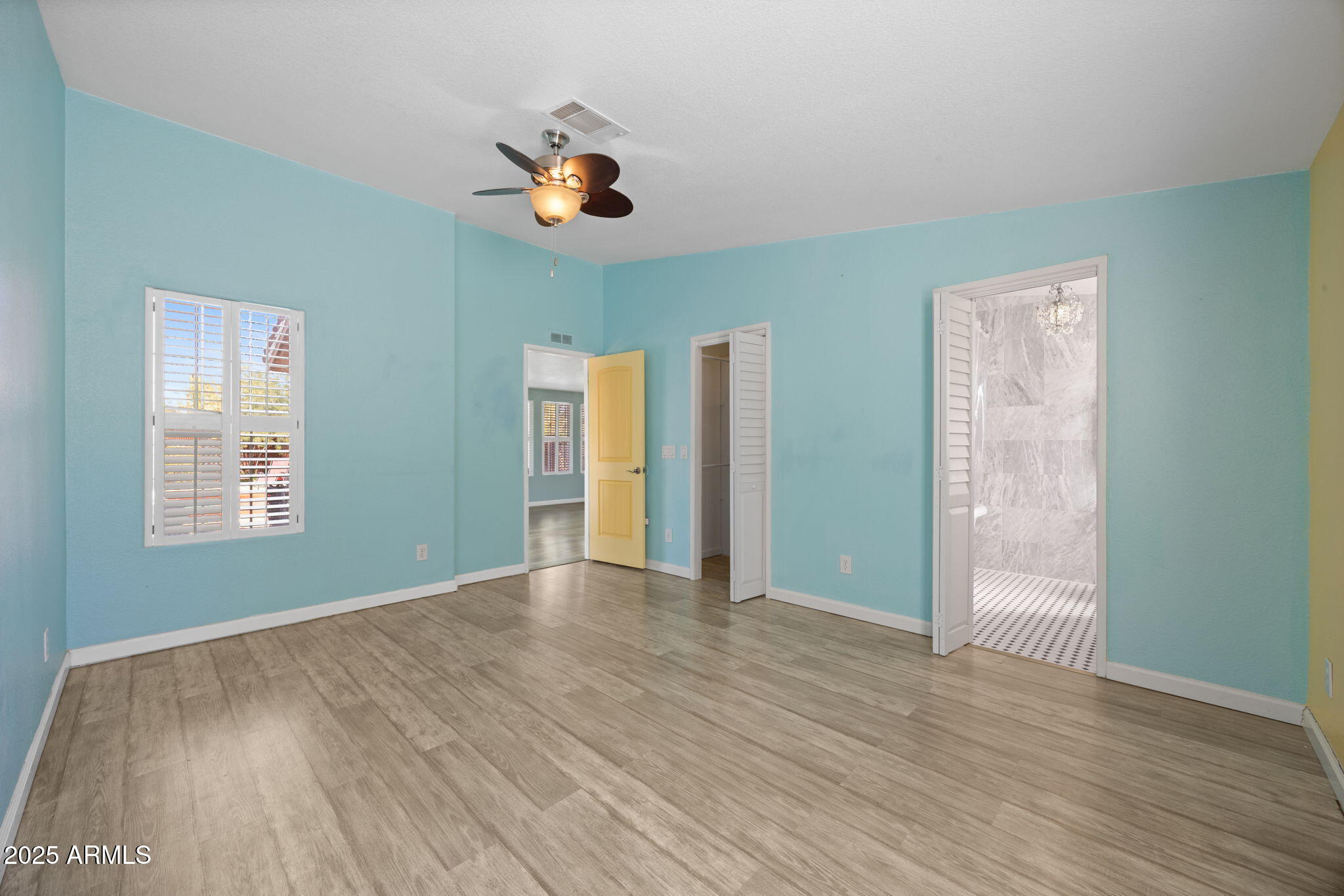 42210 North Castle Hot Springs Road Morristown, AZ 85342 - Photo 15 of 47 an empty room with wooden floor and windows