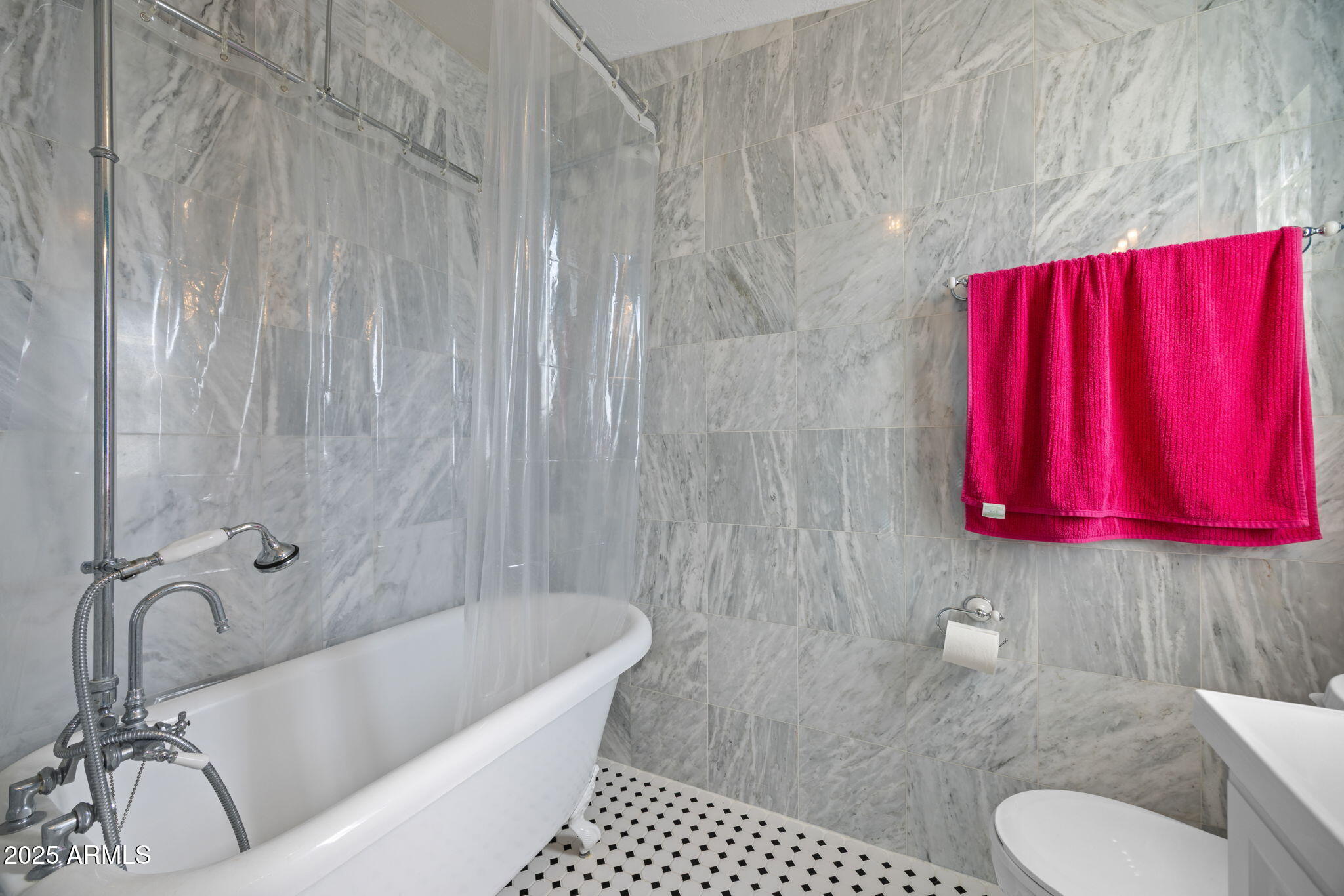 42210 North Castle Hot Springs Road Morristown, AZ 85342 - Photo 17 of 47 a bathroom with a toilet a sink and bathtub