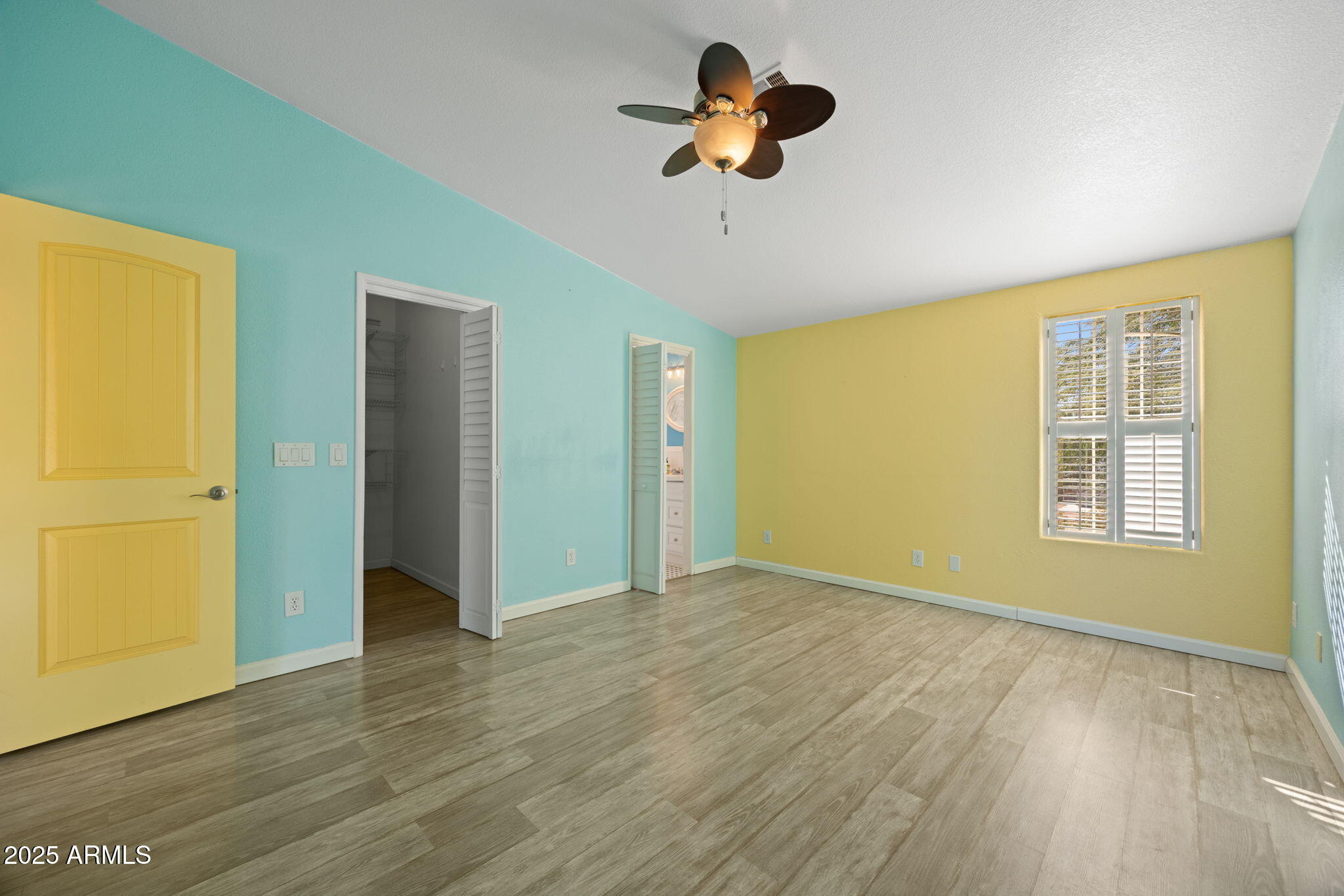 42210 North Castle Hot Springs Road Morristown, AZ 85342 - Photo 18 of 47 a view of an empty room with a window and wooden floor