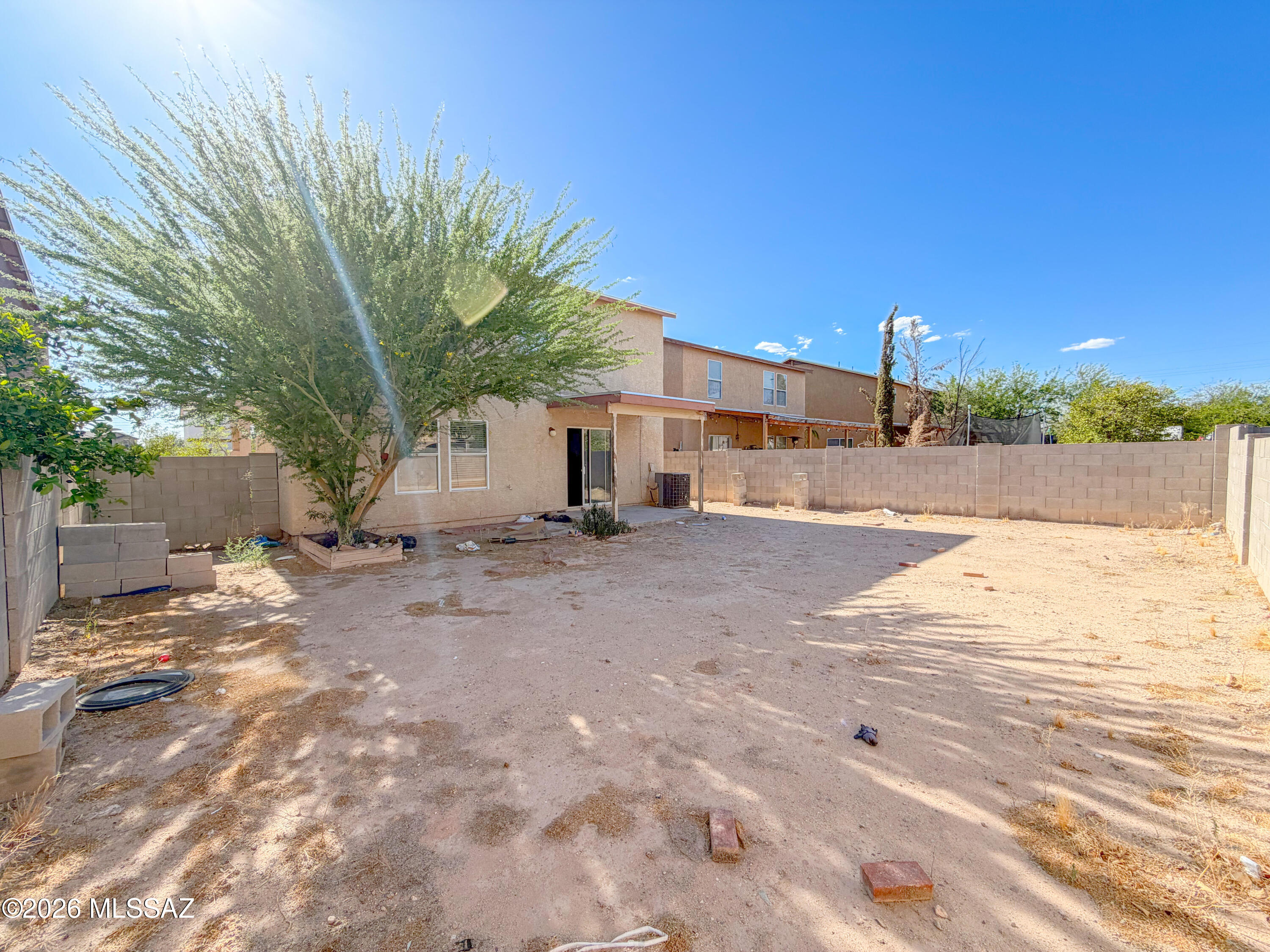 5779 South Manta Ray Road Tucson, AZ 85706 - Photo 24 of 30 a view of a street with a house in the background