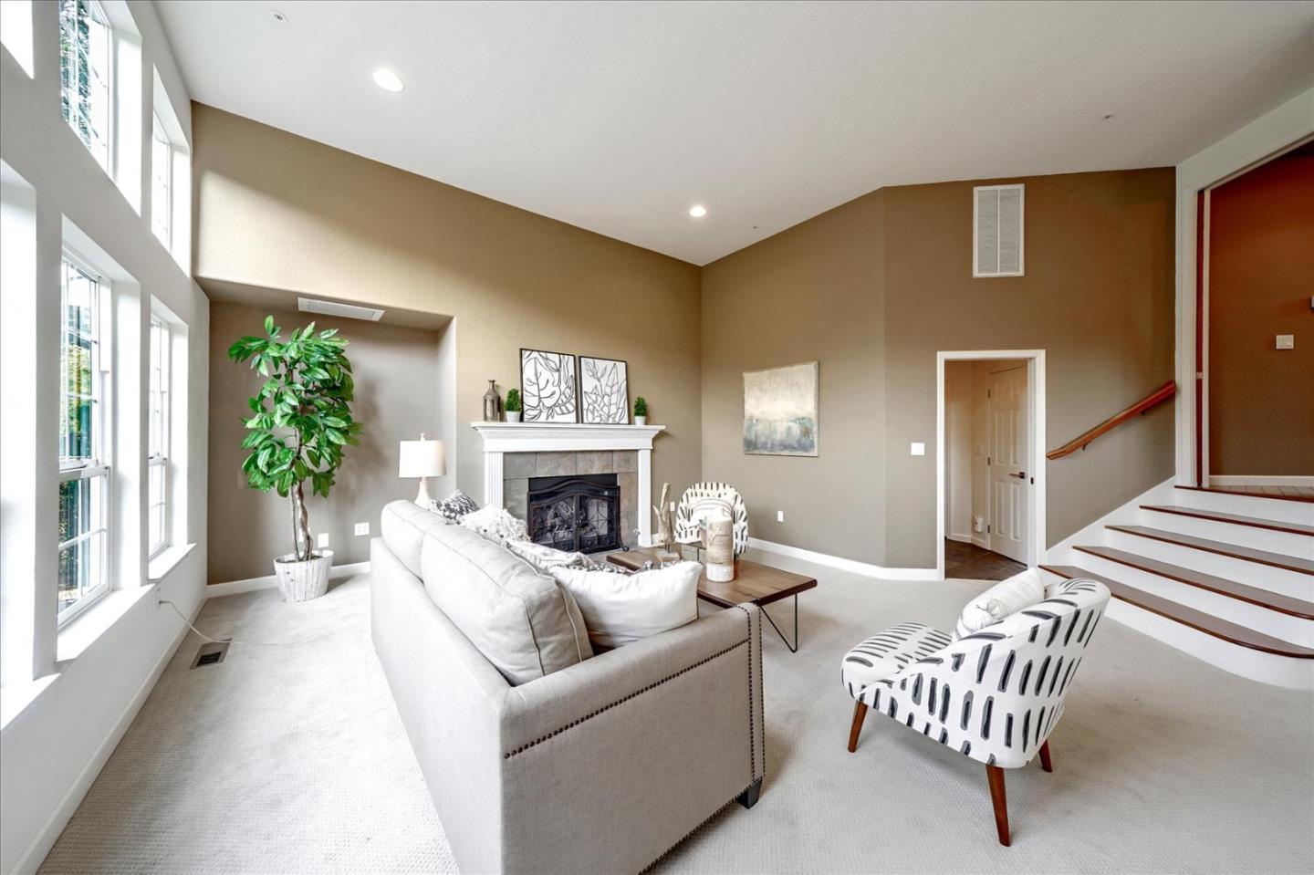 93 Ralston Ranch Road Belmont, CA 94002 - Photo 17 of 49 a living room with furniture and a fireplace