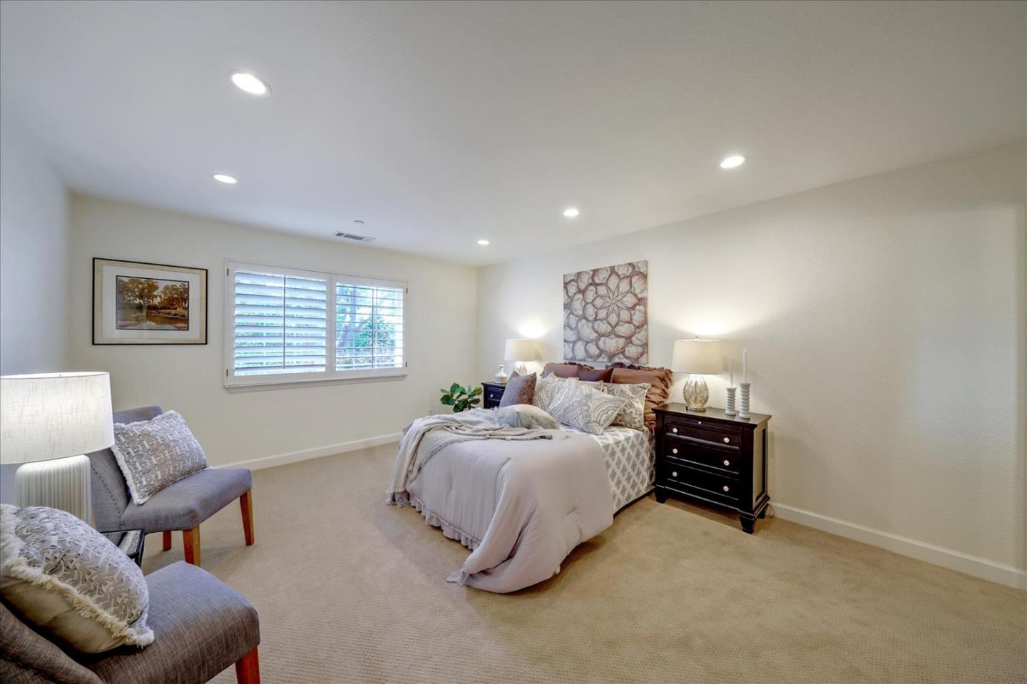 93 Ralston Ranch Road Belmont, CA 94002 - Photo 20 of 49 a spacious bedroom with a bed and furniture