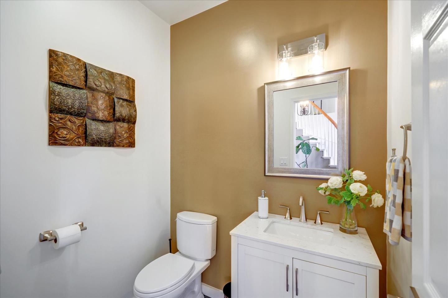 93 Ralston Ranch Road Belmont, CA 94002 - Photo 25 of 49 a bathroom with a toilet sink and mirror