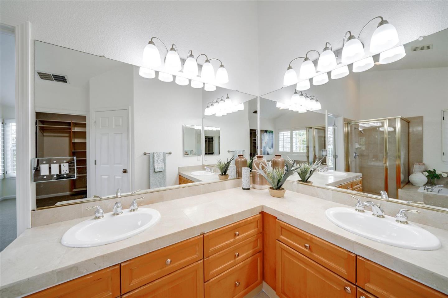 93 Ralston Ranch Road Belmont, CA 94002 - Photo 27 of 49 a bathroom with a sink double vanity and a mirror