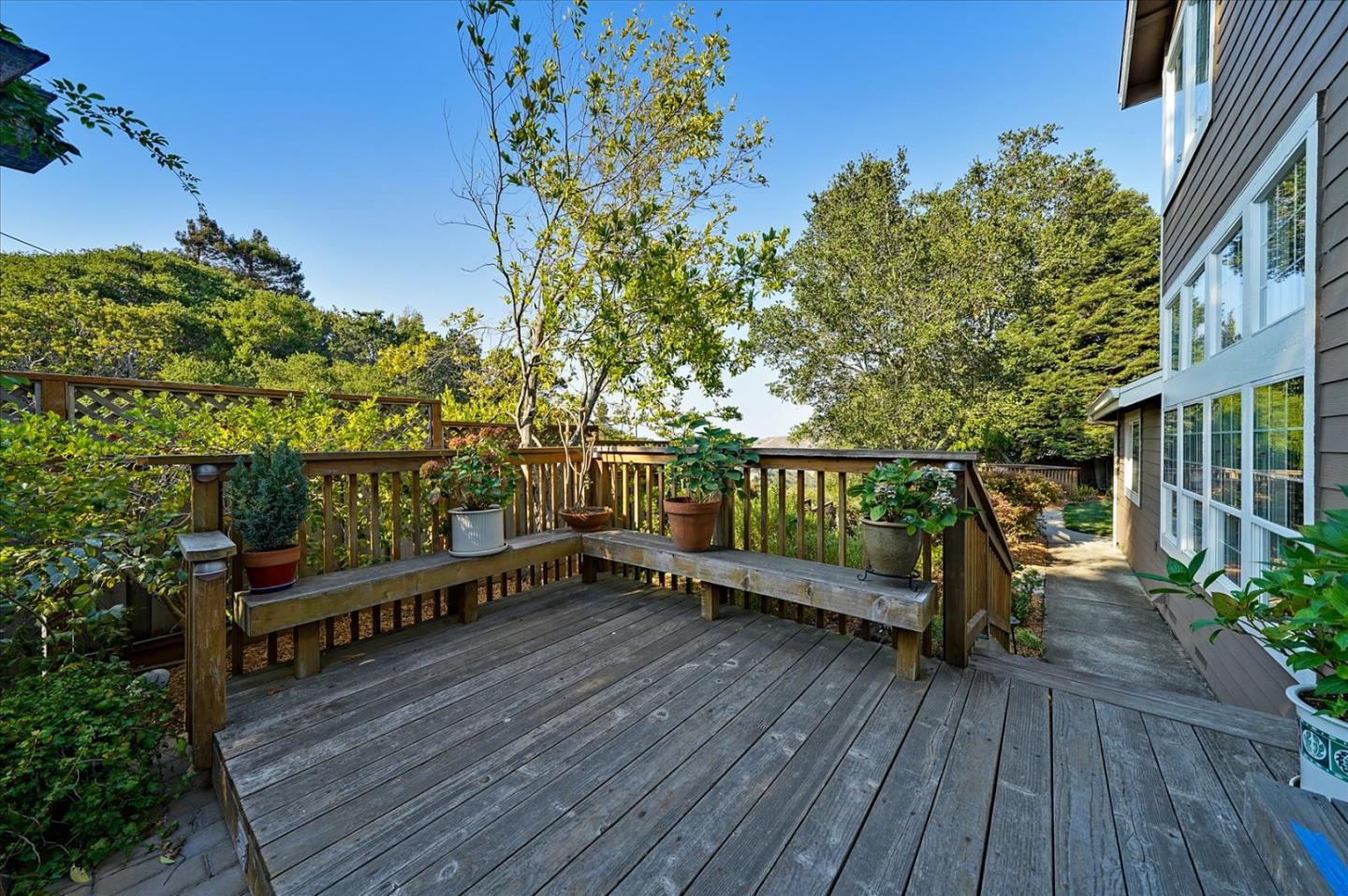 93 Ralston Ranch Road Belmont, CA 94002 - Photo 36 of 49 a view of a wooden deck with a bench