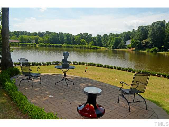 149 Chimney Rise Drive Cary, NC 27511 - Photo 17 of 24 a view of a lake with a table and chairs