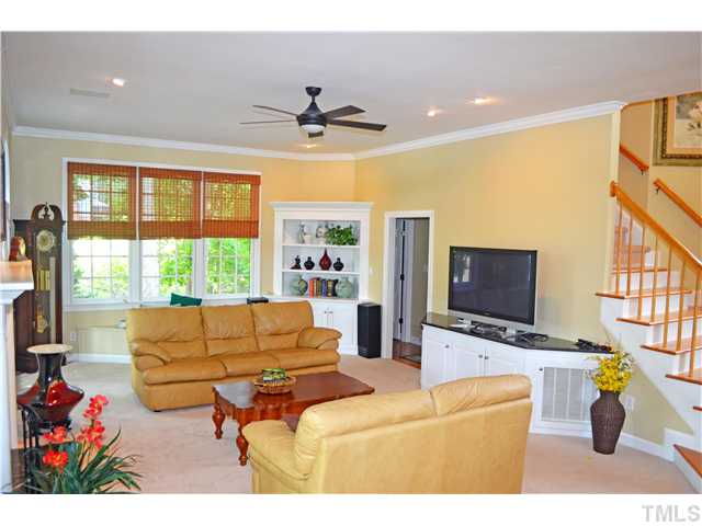 149 Chimney Rise Drive Cary, NC 27511 - Photo 24 of 24 a living room with furniture and a flat screen tv
