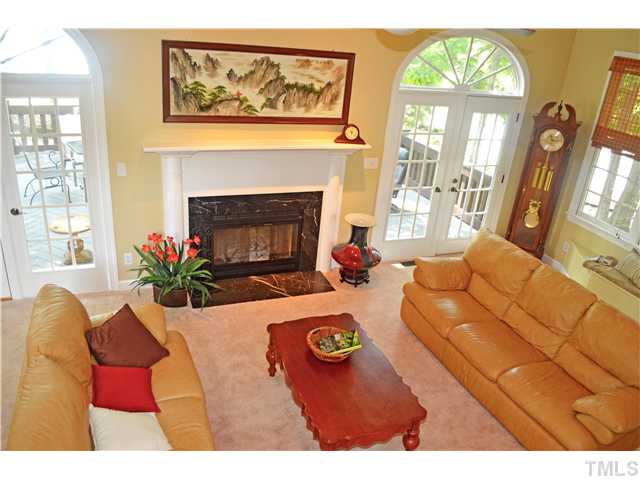 149 Chimney Rise Drive Cary, NC 27511 - Photo 5 of 24 a living room with furniture fireplace and a large window