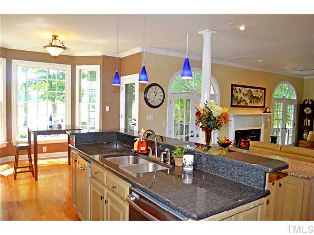 149 Chimney Rise Drive Cary, NC 27511 - Photo 10 of 24 a kitchen with a table and a view of living room