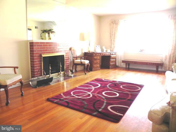 1901 Elton Road Adelphi, MD 20783 - Photo 16 of 27 Living Room with Fireplace, wood floors, windows++