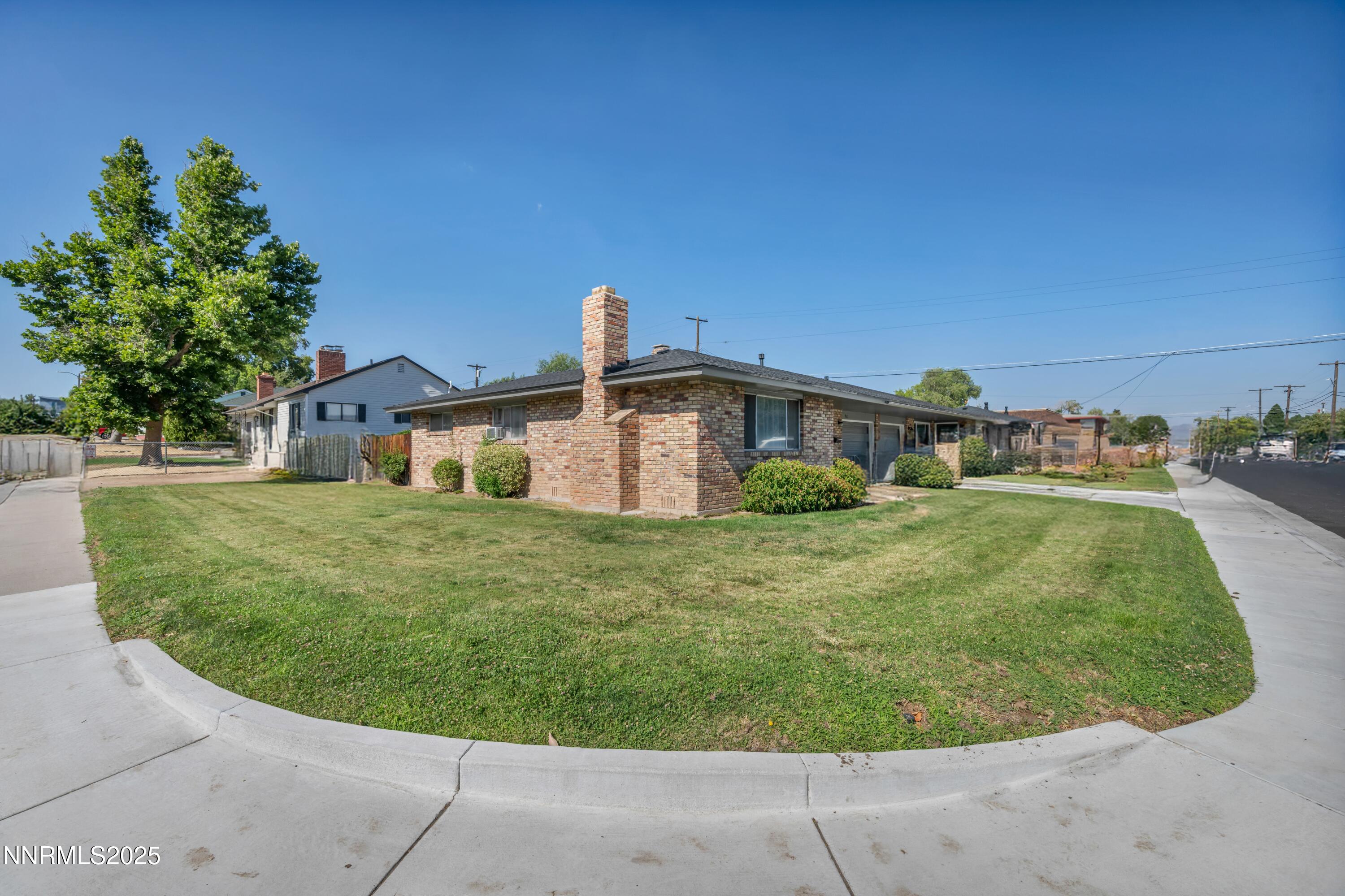 905 East Taylor Street Reno, NV 89502 - Photo 3 of 23 a front view of a house with a garden