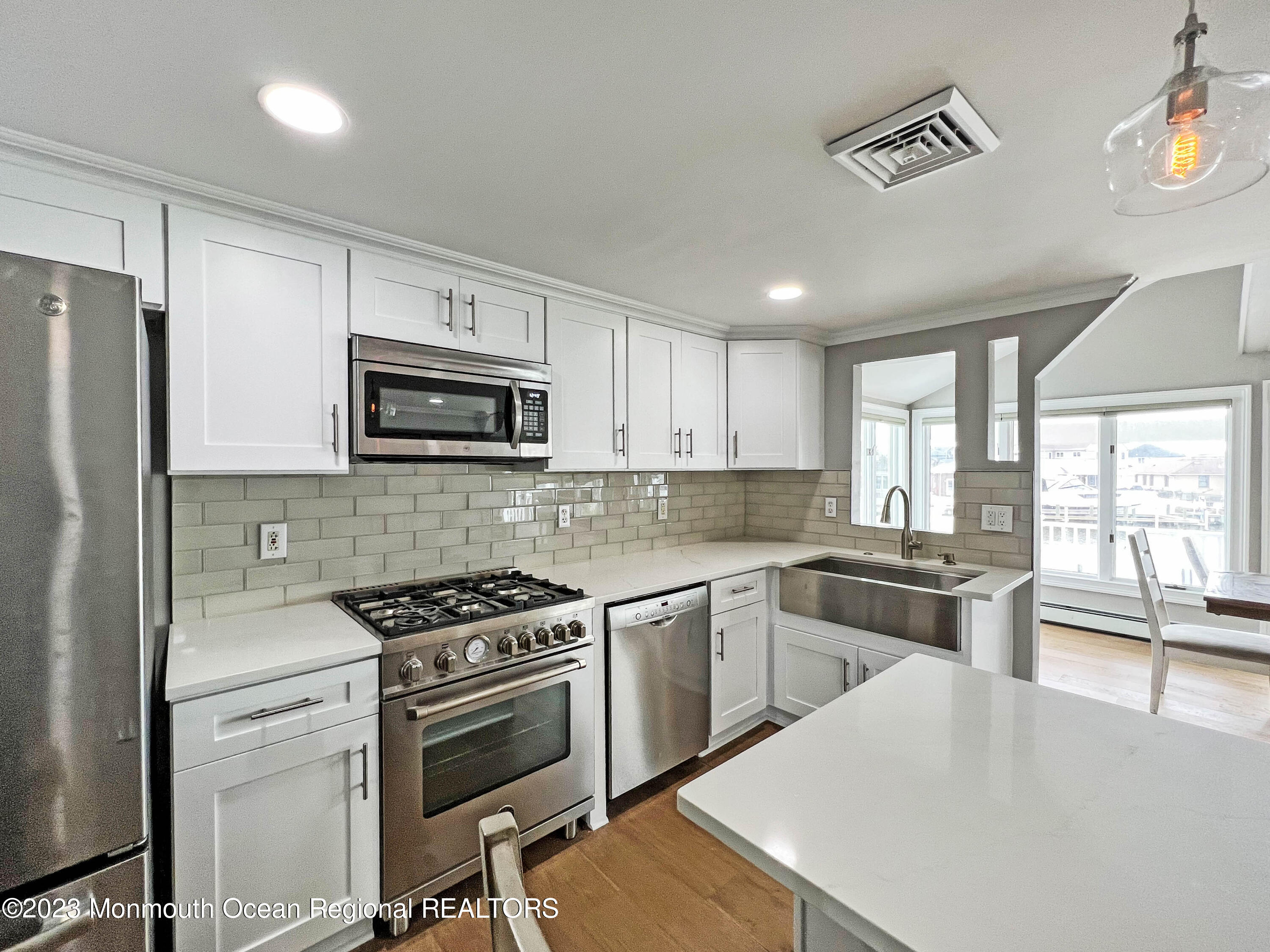 43 Woodhaven Road Toms River, NJ 08753 - Photo 11 of 67 a kitchen with a stove a sink and a refrigerator