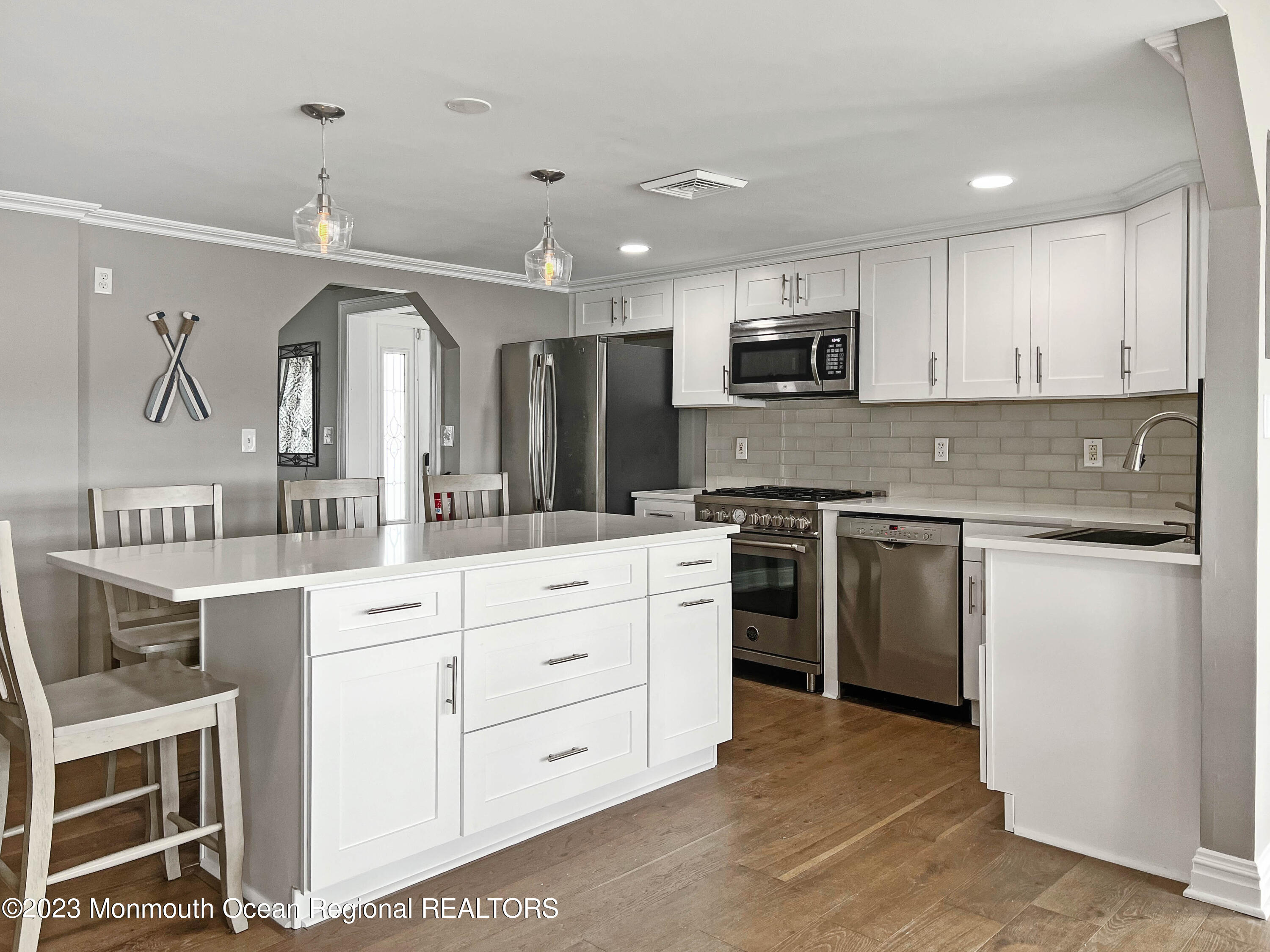 43 Woodhaven Road Toms River, NJ 08753 - Photo 18 of 67 a kitchen with white cabinets and stainless steel appliances