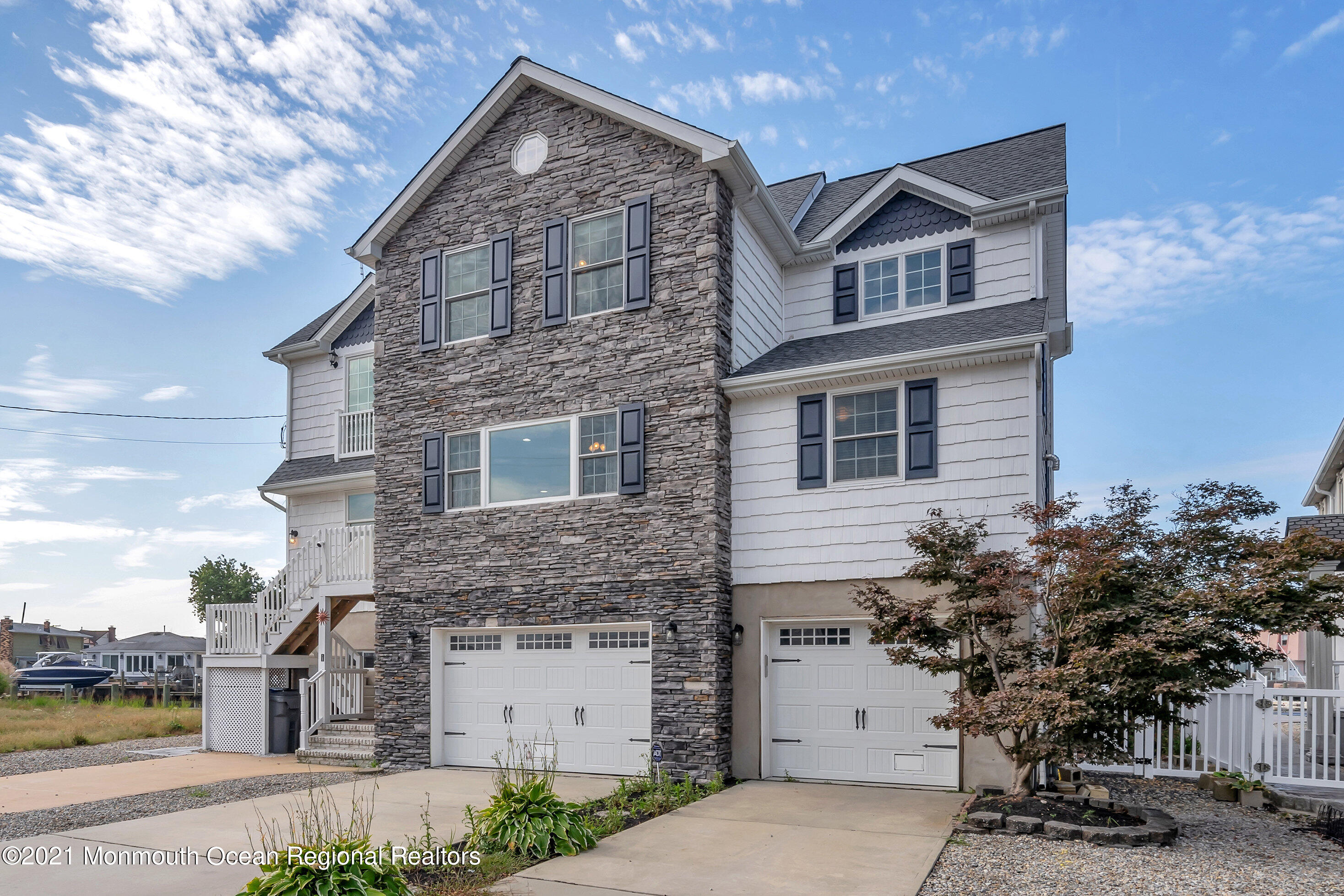 43 Woodhaven Road Toms River, NJ 08753 - Photo 2 of 67 a front view of a house with a yard