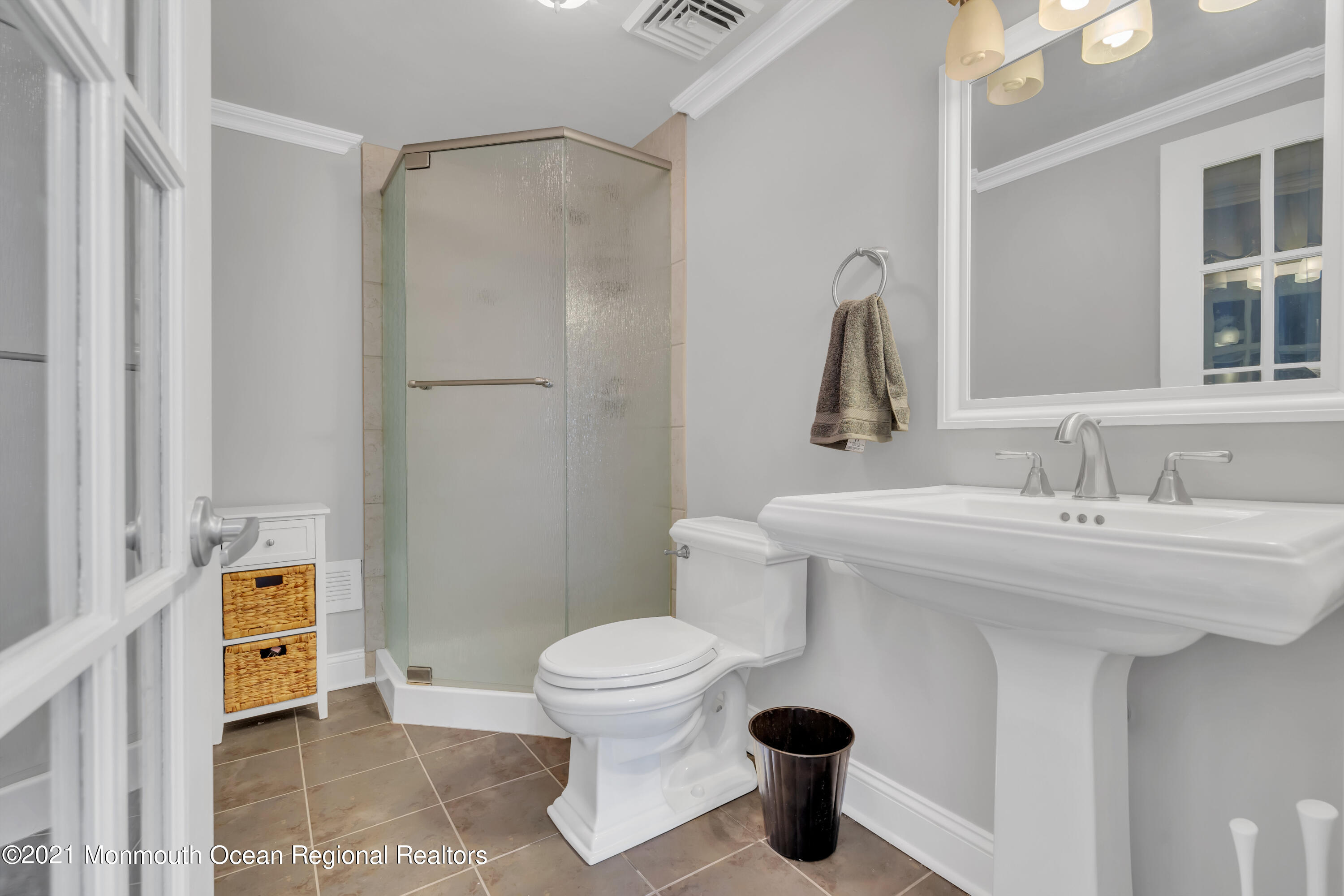 43 Woodhaven Road Toms River, NJ 08753 - Photo 24 of 67 a bathroom with a sink a toilet and a mirror