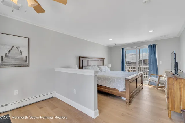 a view of a lake with boats and trees in the background