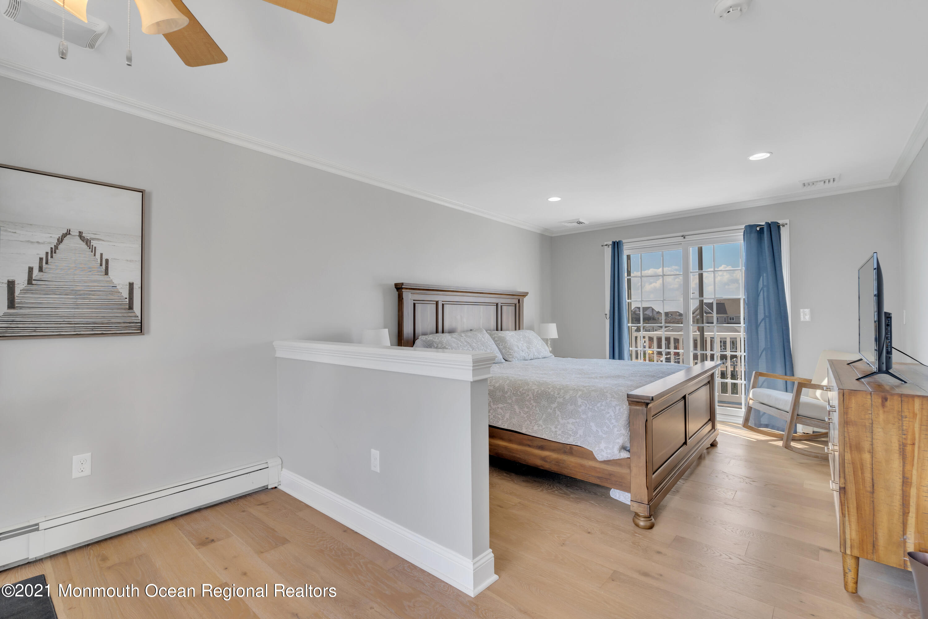 43 Woodhaven Road Toms River, NJ 08753 - Photo 43 of 67 a bedroom with a bed and glass wall