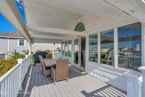 a view of a lake with boats and trees in the background