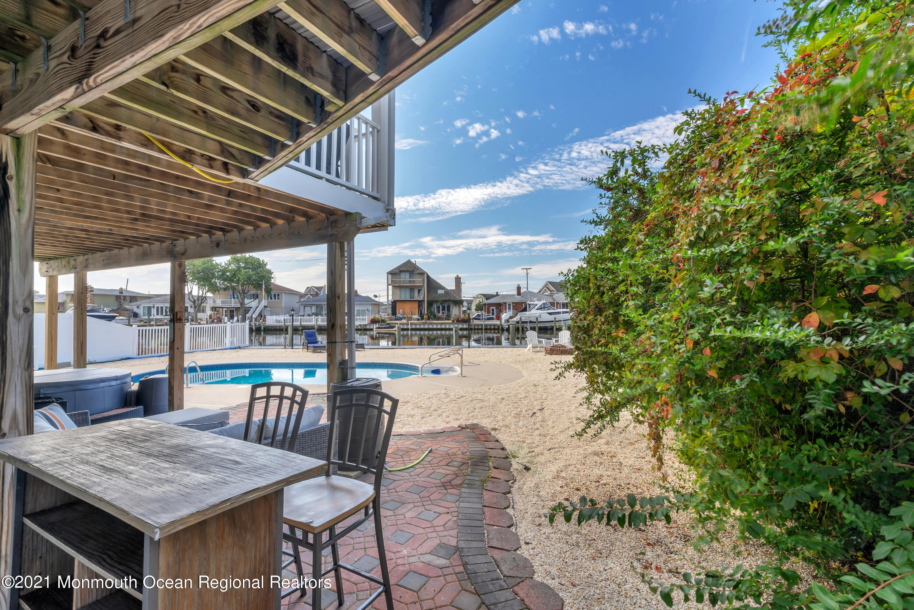 43 Woodhaven Road Toms River, NJ 08753 - Photo 48 of 67 a view of a patio with a table and chairs