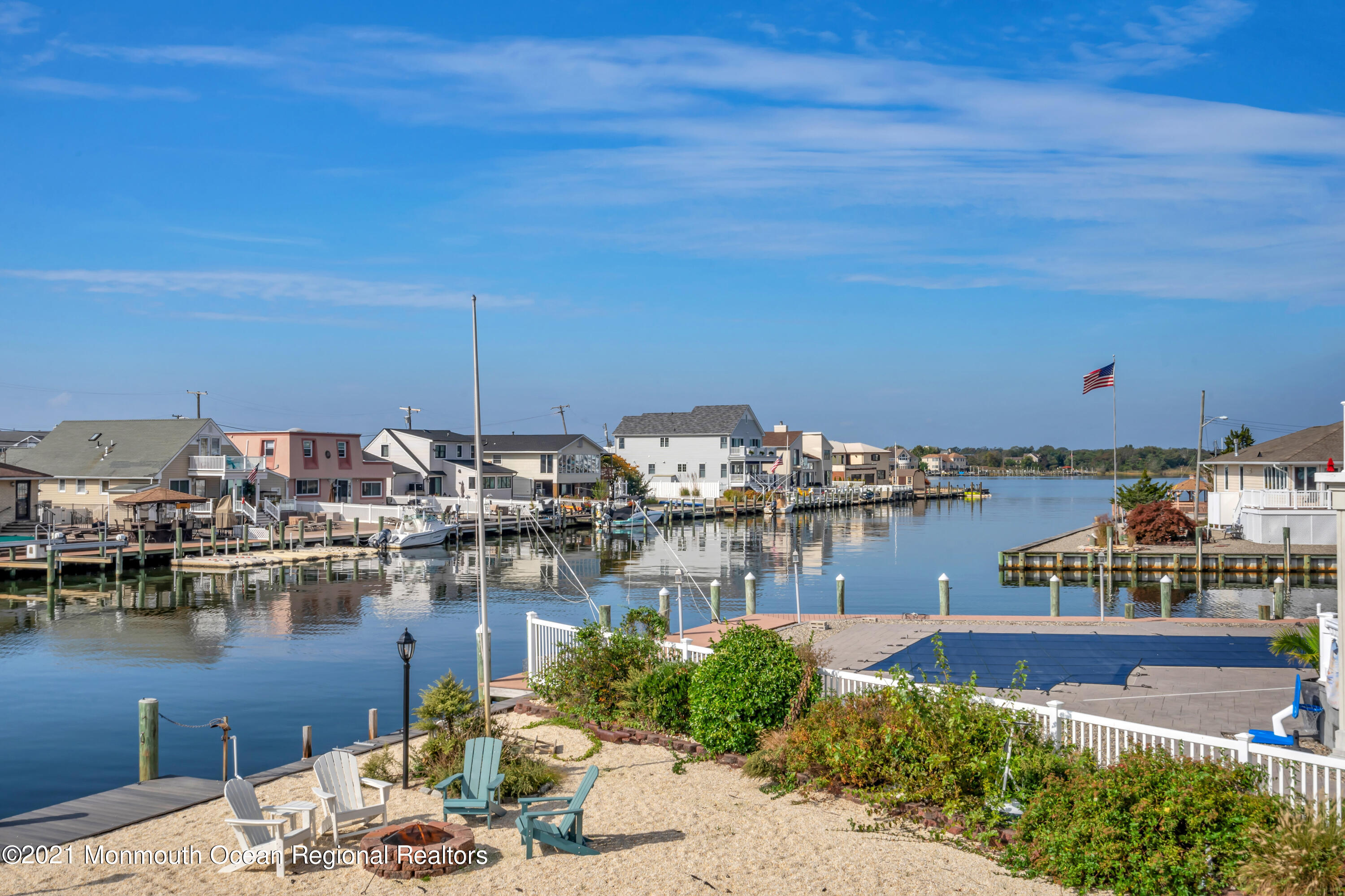43 Woodhaven Road Toms River, NJ 08753 - Photo 57 of 67 a view of a lake with boats and a bridge
