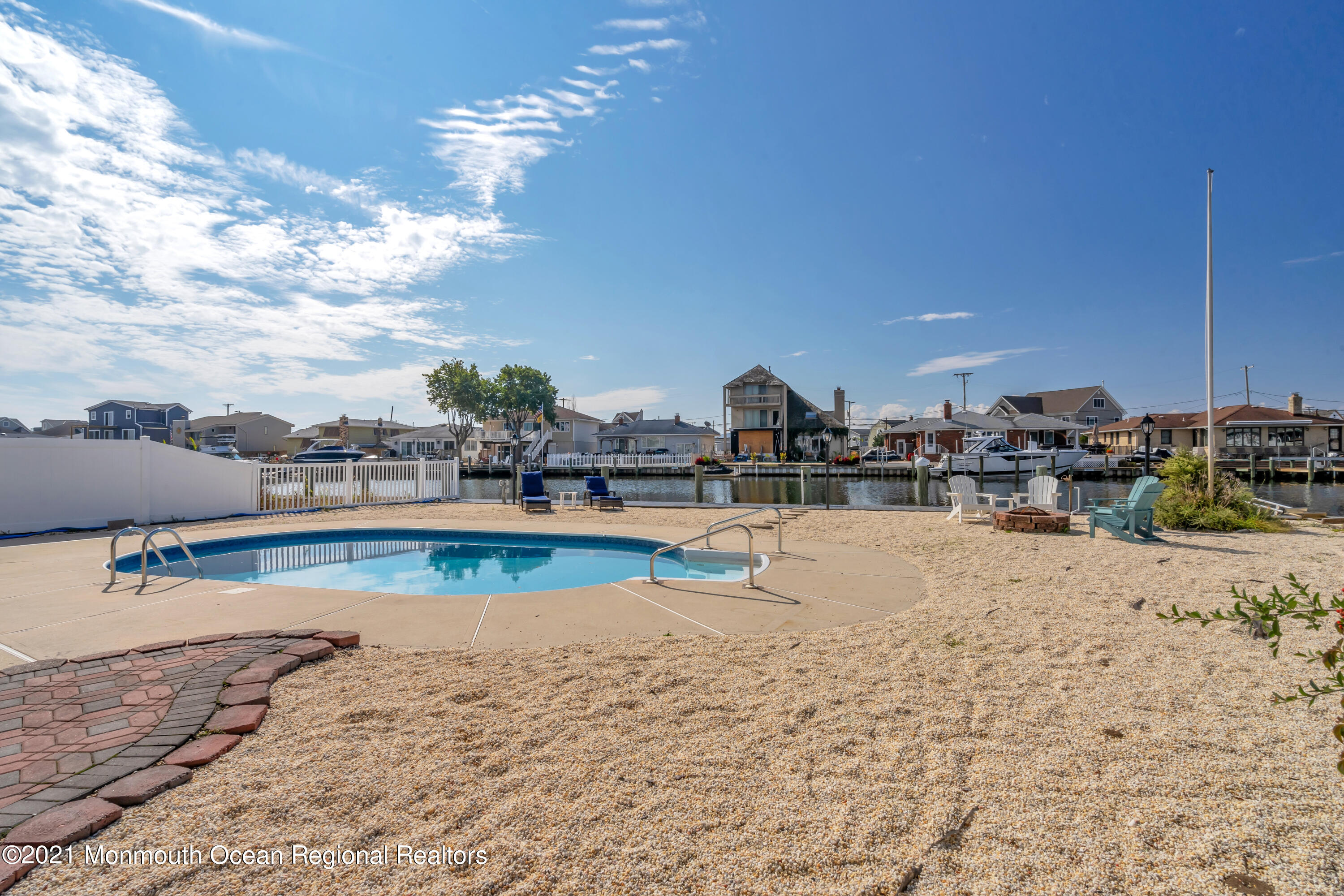 43 Woodhaven Road Toms River, NJ 08753 - Photo 62 of 67 a view of swimming pool with outdoor seating